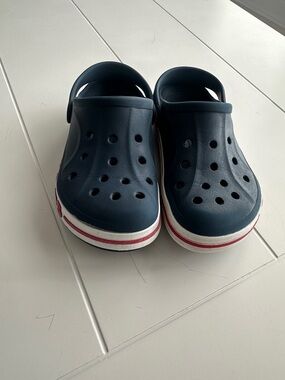 CROCS Navy Kids Clogs with Red and White Midsole Stripe